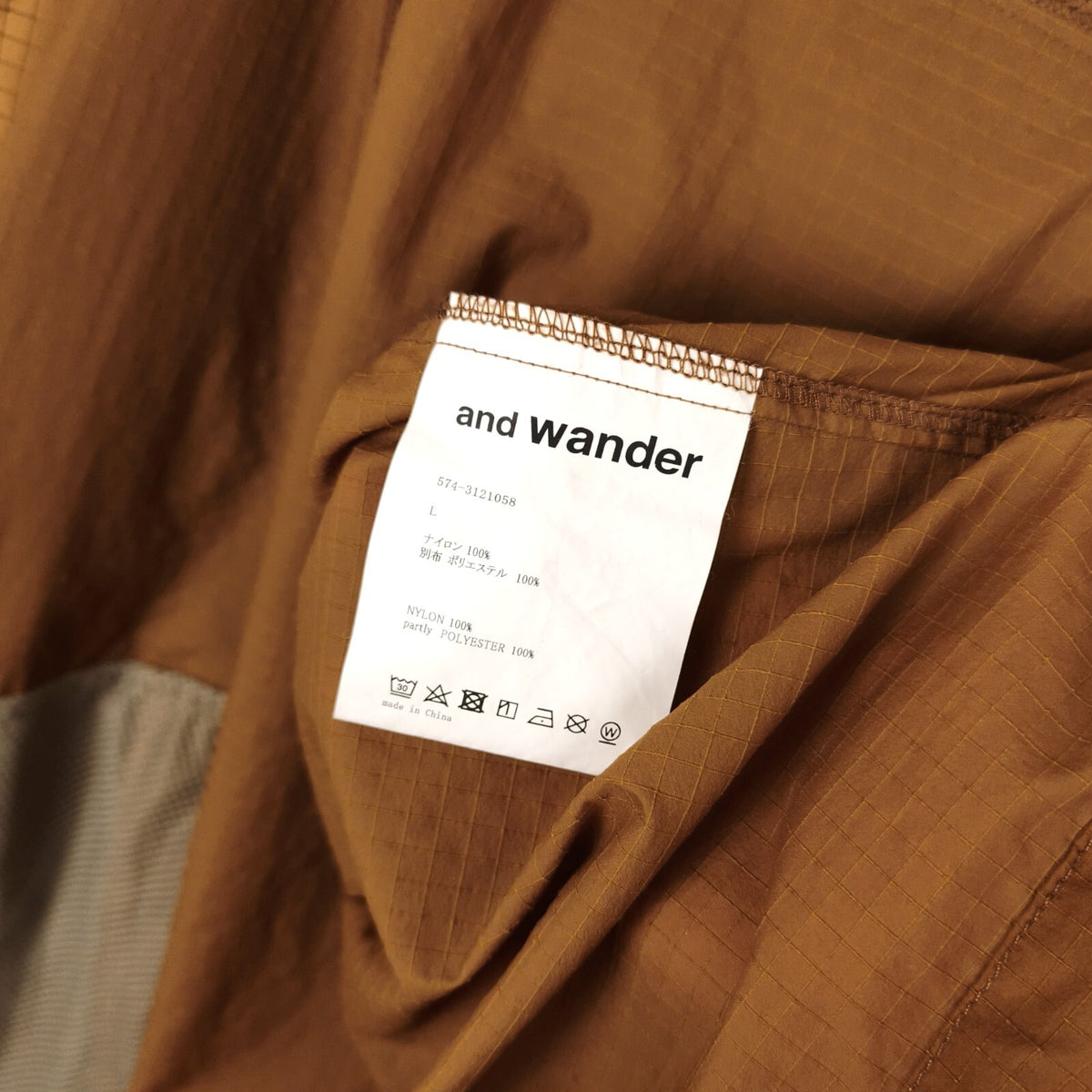 AND WANDER Men's Brown Breath Rip Hooded Jacket